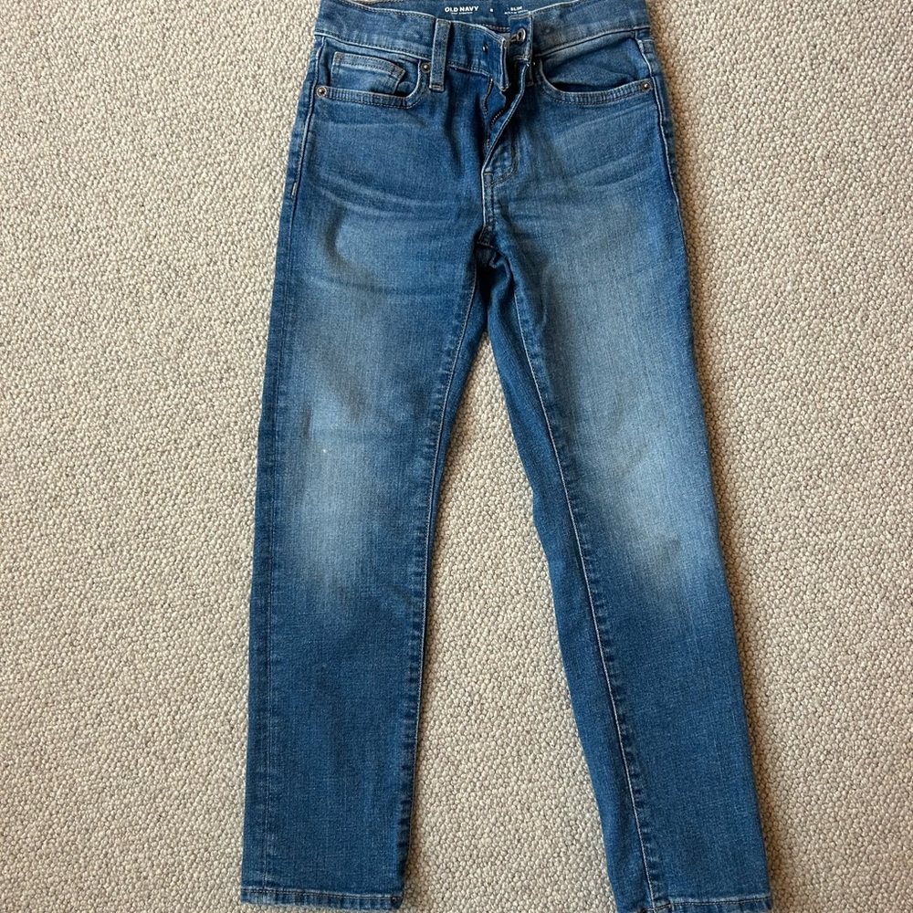 Medium Blue Slim Jeans with Distressed Details and Straight Leg